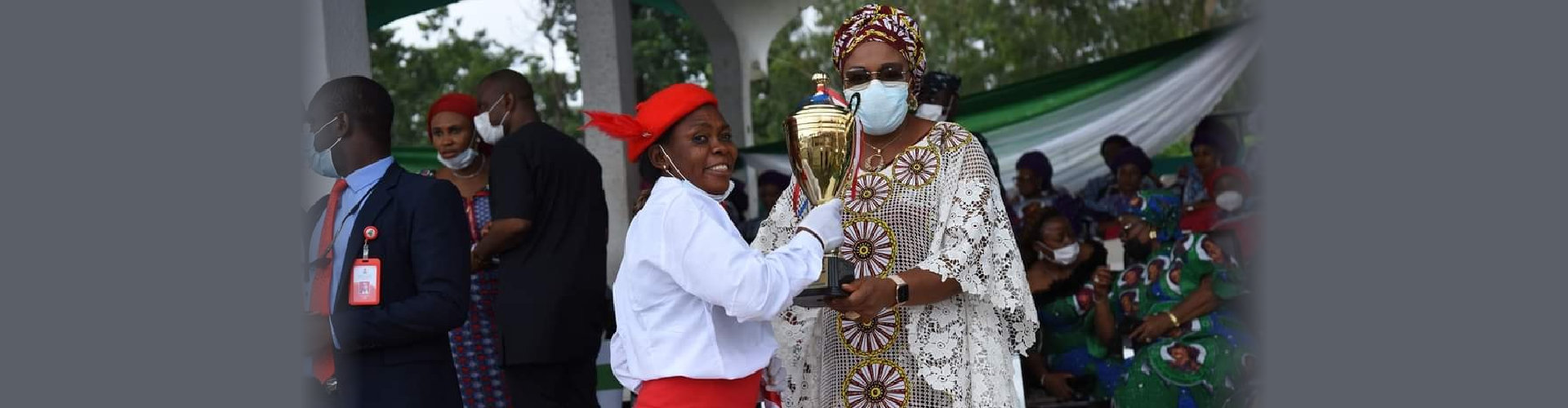 lady holding a trophy